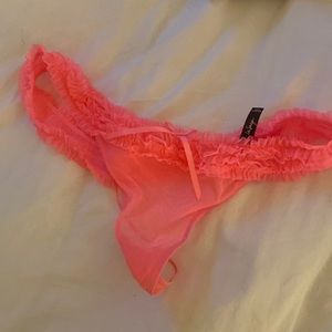 Neon pink ruffle g-string